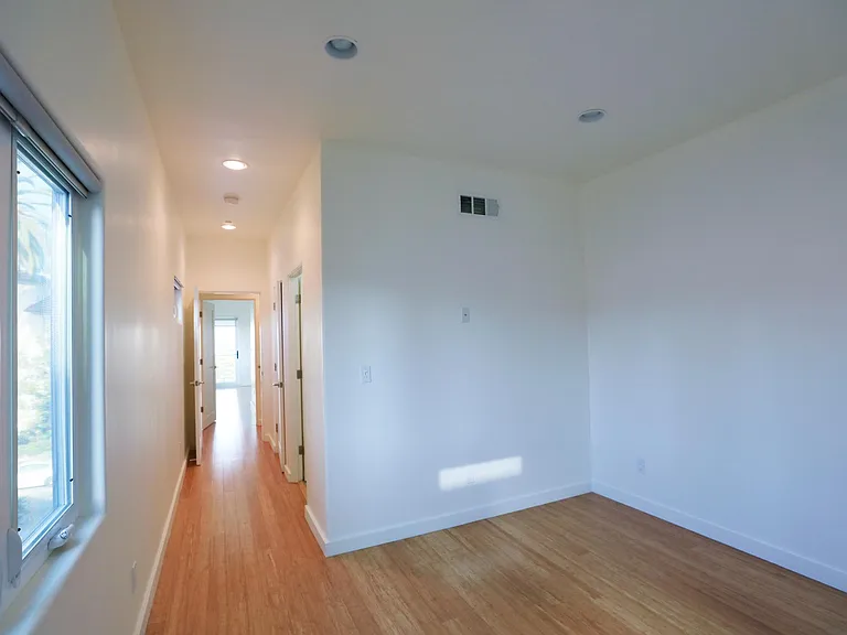 Rear Bedroom Hallway Leading to Bathroom, Closet and Front Bedroom