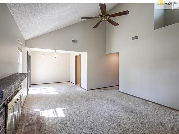 Family room looking at dining room.  To the far right is kitchen.  To the immediate right is hallway which leads to bedrooms and bathroom.
