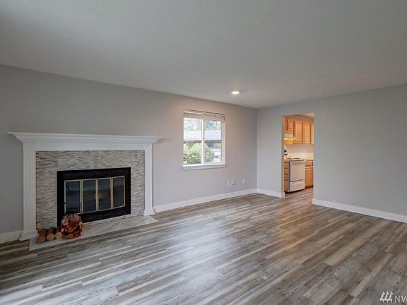 Living room looking into dining area and into the kitchen. 