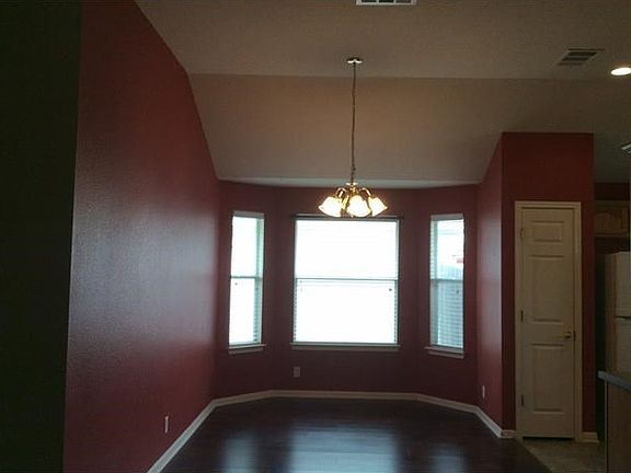 The dining room is not this dark, photographer error!  It is a high-ceilinged room with lovely bay window right off the kitchen.