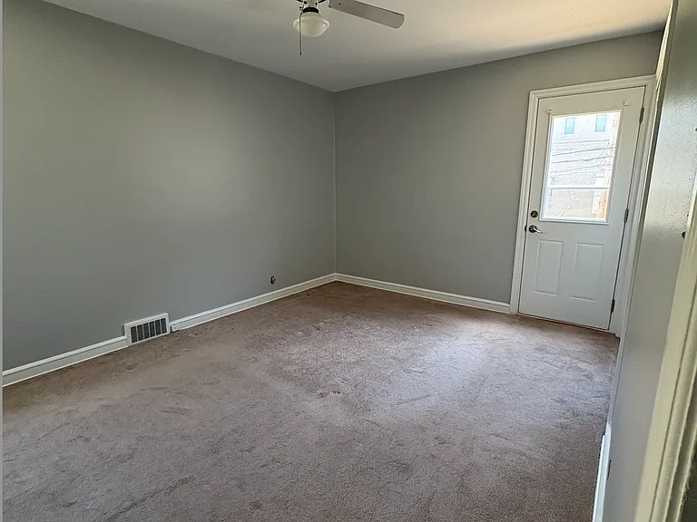 Bedroom #1 with walk out patio
