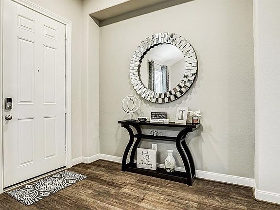 Welcome home! This lovely entry way is perfect to showcase art, photos, and decor. Something to note, the owner has paid heavily