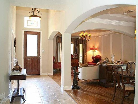 Inviting foyer is flanked by the study on the right, and the formal sitting area to your left once y