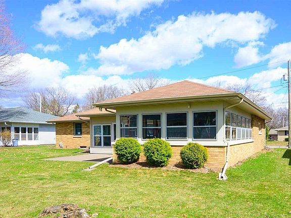 Backside of garage/3 season room/house