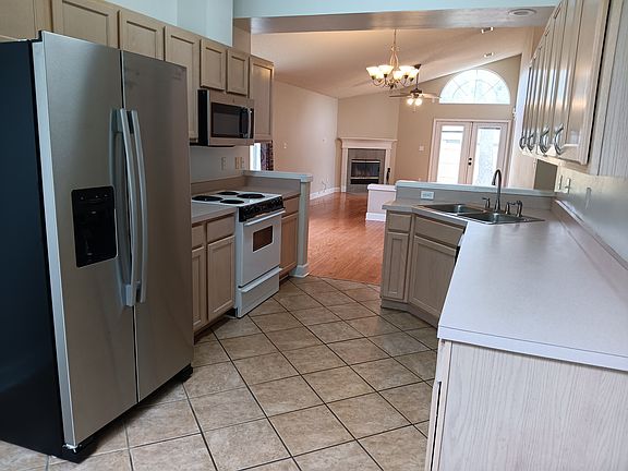 open floor plan from kitchen into dining room and living room