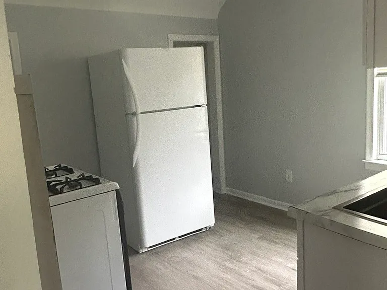 Stove and Refrigerator in newly remodeled kitchen