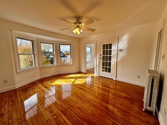 Living room with Bow windows