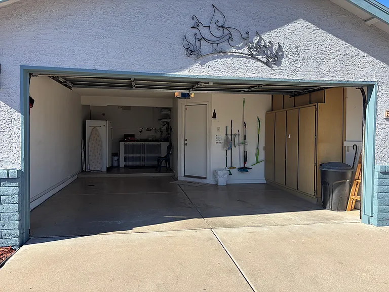 Garage with entry Room for one car and a golf cart