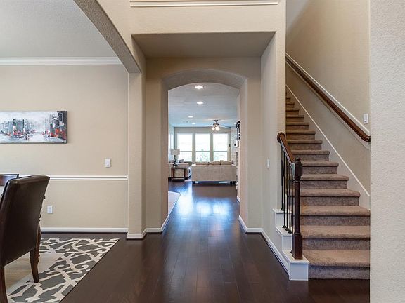 You will immediately feel the warmth of this home, with the gorgeous hardwood flooring that flows from the entry, formal dining and family room!