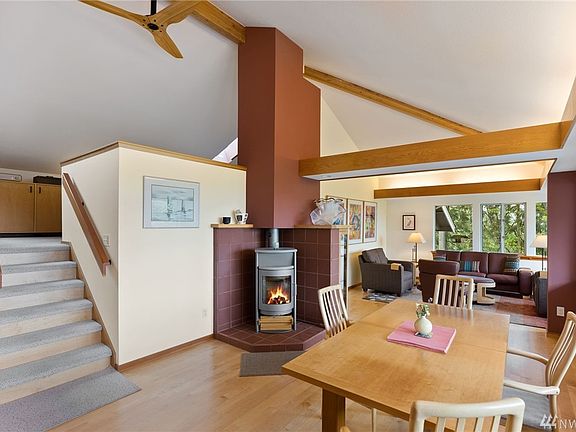 Gorgeous lines, custom wood beams, Rais Danish wood-burning fireplace grace you when you come into this home. 