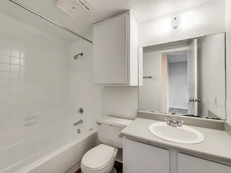 Clean, well-appointed bathrooms with modern finishes and plenty of storage.