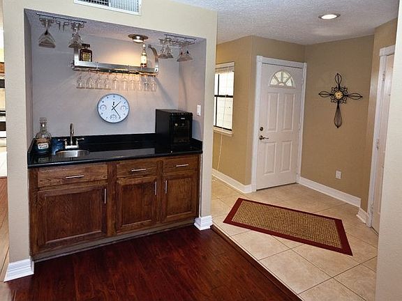 The wet bar has a granite countertop