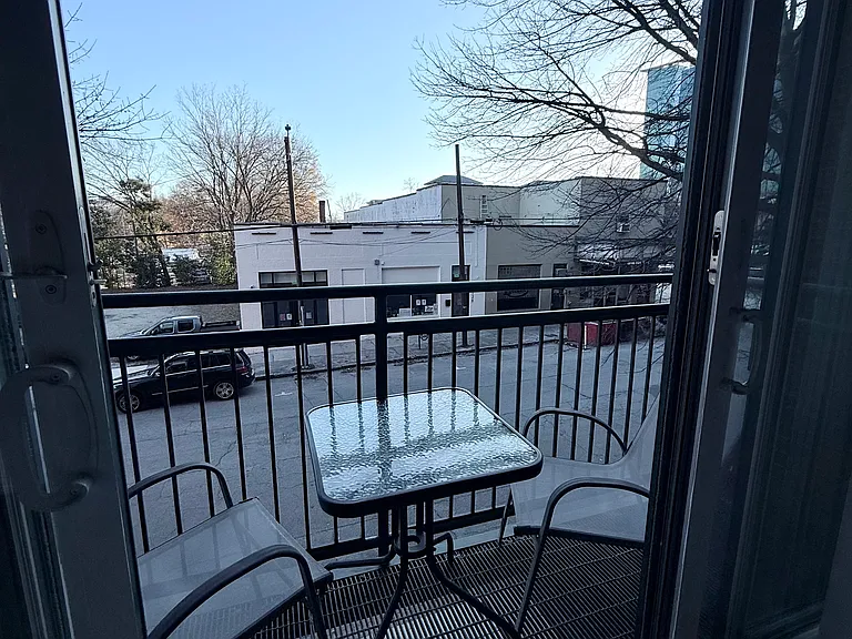 private balcony with table and two chairs