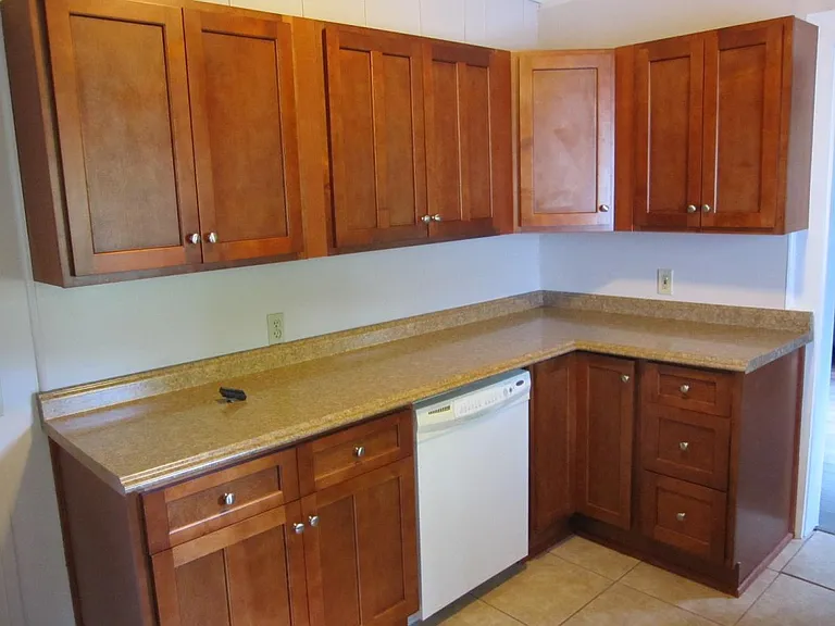 Newer kitchen cabinets. Newer Bosch black dishwasher not shown.