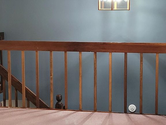 Foyer & staircase from front door up & down to split levels. From Great room