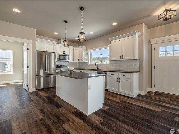 Front door into open concept great room with LVP flooring, lots of beautiful natural light.