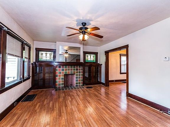 The full wall of windows brings lots of bright light into the room, while the 2 doorways create an open floor design that is ple