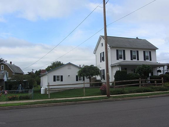 Front view with 4 car garage
