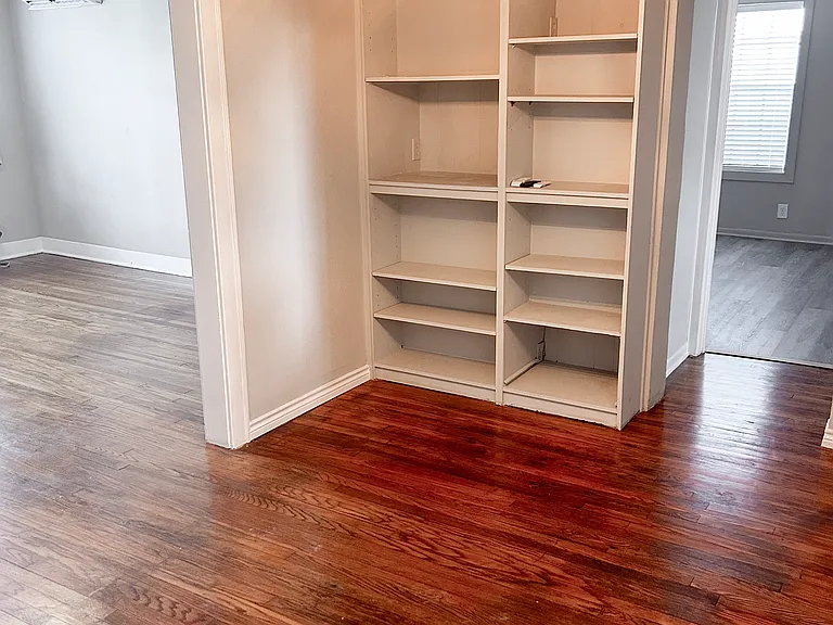 Dining area with built in bookshelves.