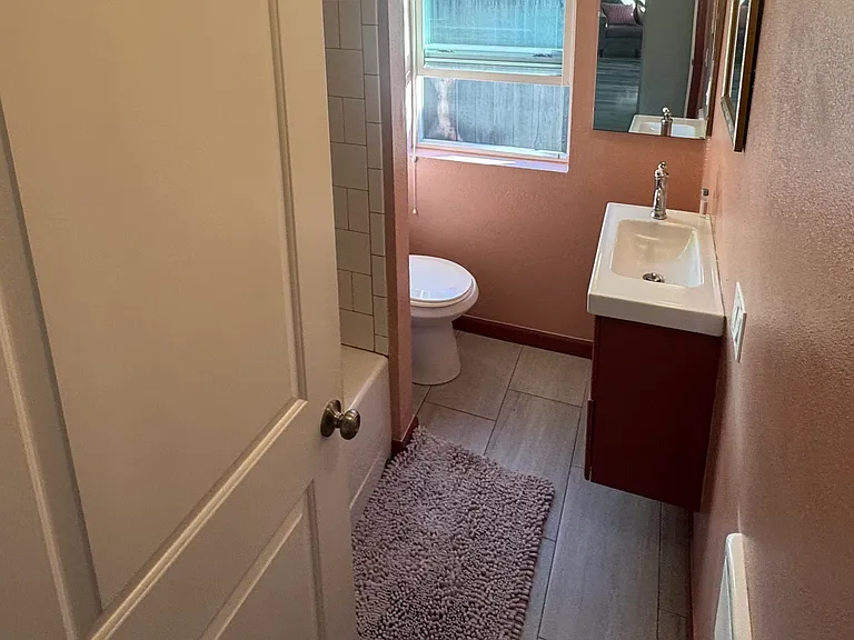 Bathroom contains a bath/shower