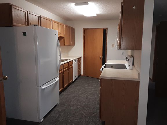 Kitchen with door leading into laundry room
