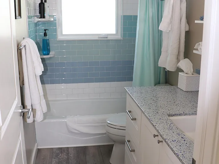 Huge counter and tons of storage in the bathroom.