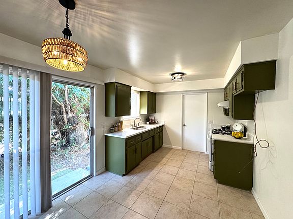 updated kitchen with new kitchen counter tops and new lighting