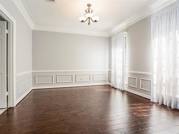 There are updated engineered wood floors in the in the formal dining room, with updated lighting.