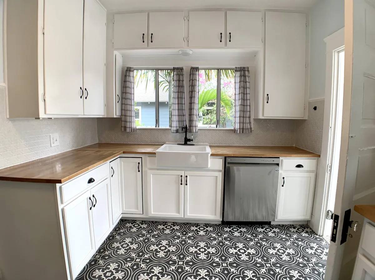 Kitchen with butcher block countertops, dishwasher and sink. - 1008 N Azusa Ave