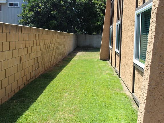 This is right of the front door area leading to the shared backyard.