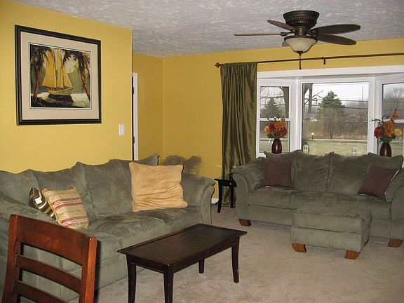 The large bay window brings tons of light into the cozy living room.