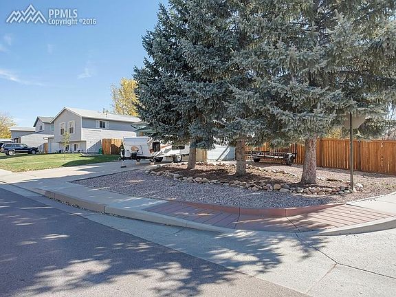 Nice Corner lot with Xeriscaping and mature trees.
