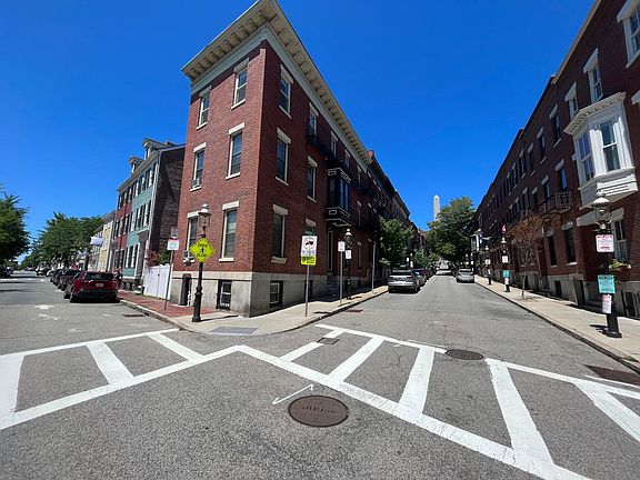 Building is located on the corner of Monument Avenue & Warren Street in the historical gas light district
