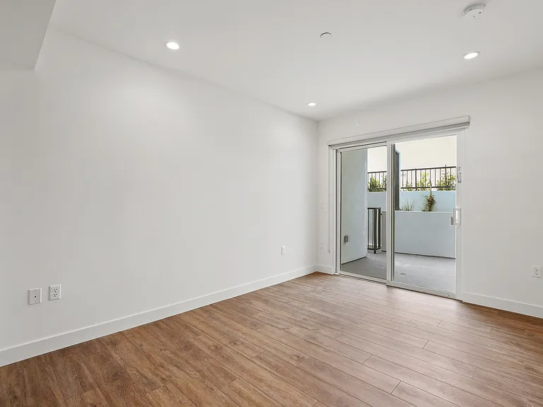 Bedroom with Recessed Lighting, Vinyl Flooring, and Patio