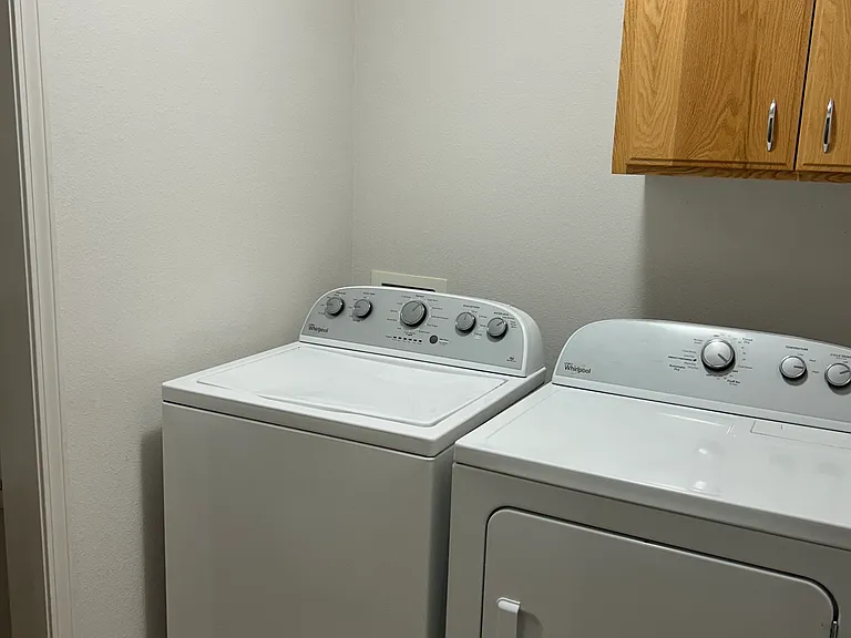 Laundry room with included washer and dryer
