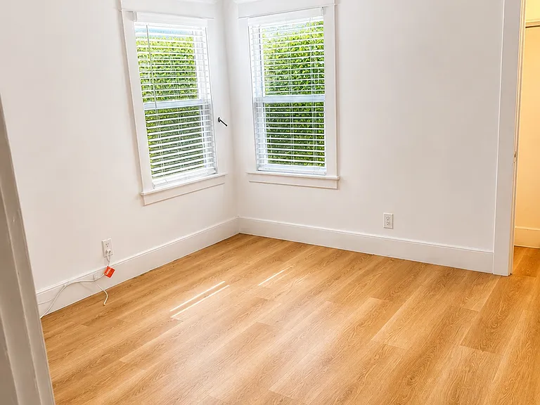 Bedroom 2 with view of yard