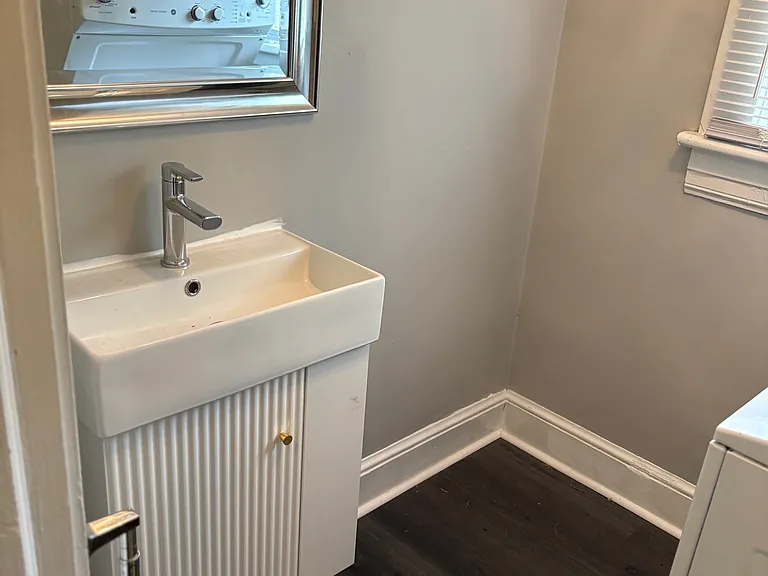 Completely Renovated Half Bath! New Luxury Vinyl Tile, New Vanity, Mirror, Crystal Lighting Fixture, Floating Shelves and NEW Stackable Washer/Dryer!