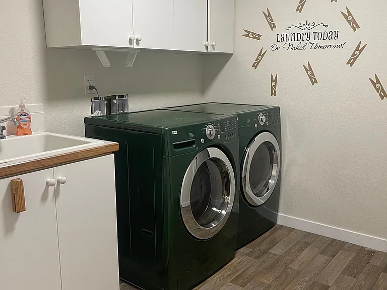 Separate laundry room - huge washer and dryer
