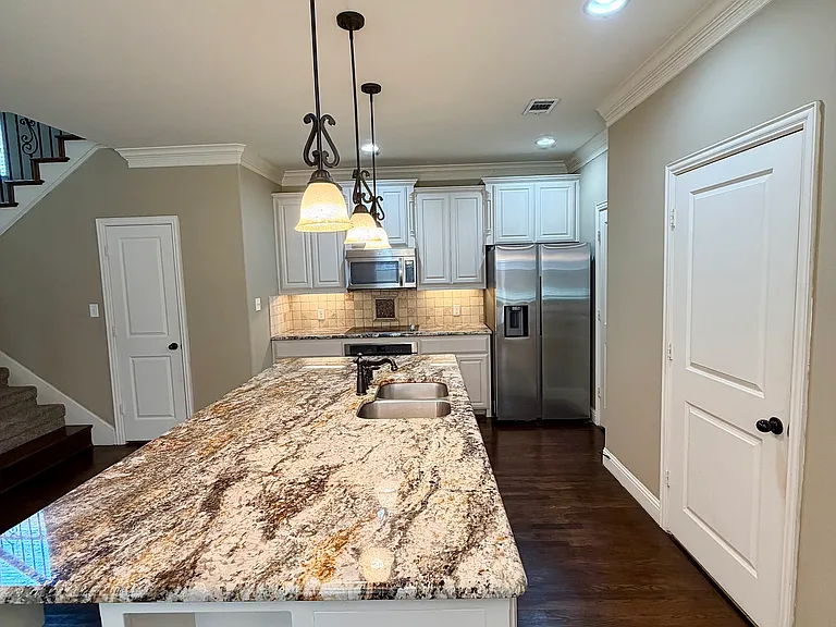 Kitchen with refrigerator included