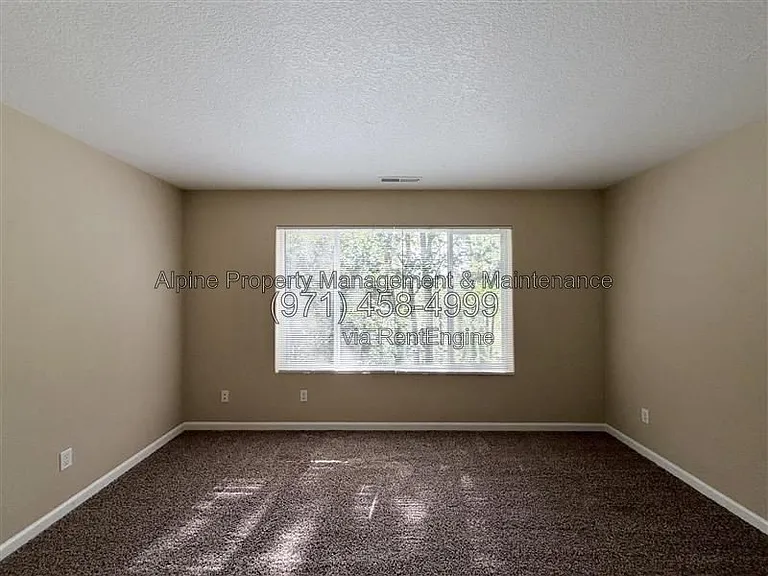 5758 NE Damsel Dr — Photo 27