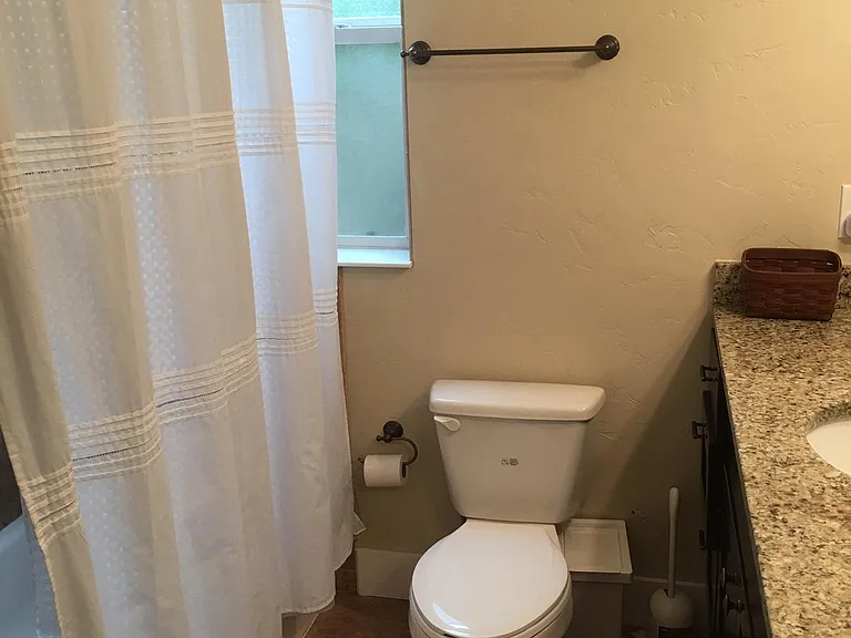 Middle bathroom located between front and middle bedroom (closet to the left of the tub)