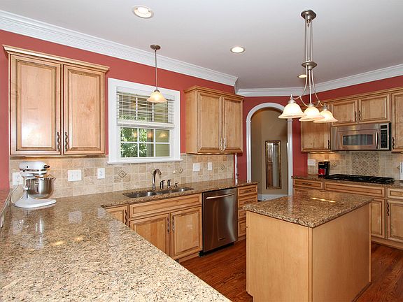Granite, stainless appliances and a center island make a true gourmet kitchen.