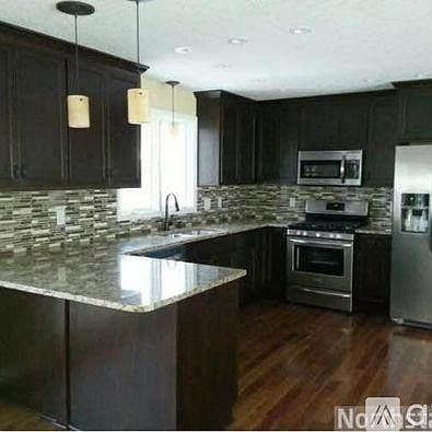 Full Kitchen with stainless steel appliances.