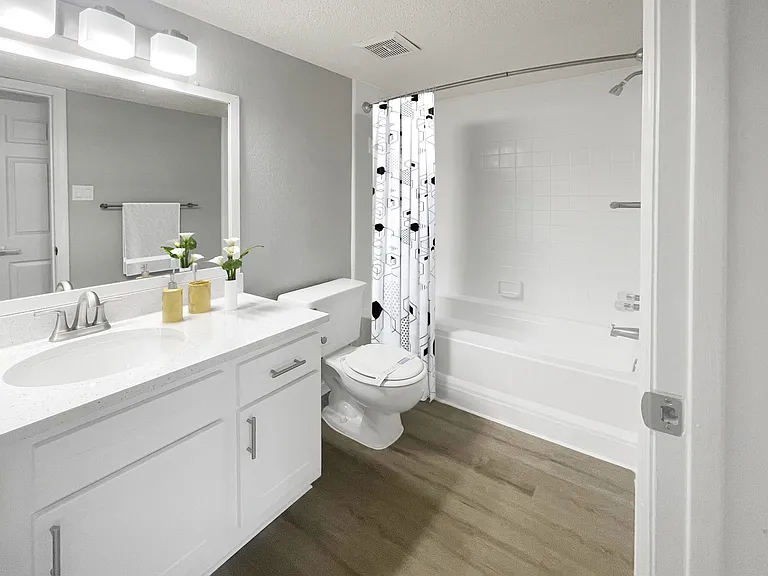 Upgraded Bathroom with White Cabinets