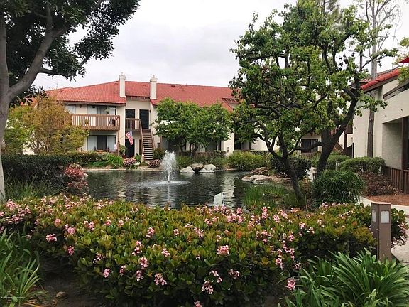 a pond in front of the condo unit