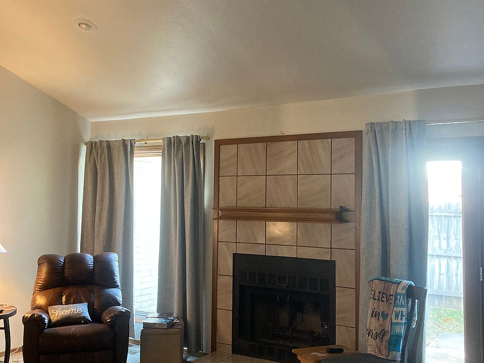 Living Room with Fireplace (ceiling fan)