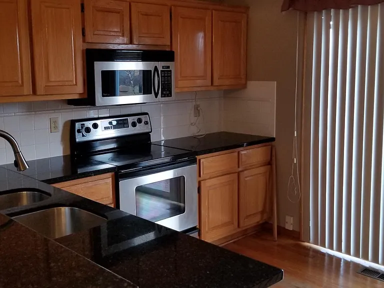 Kitchen - Microwave, range and oven.