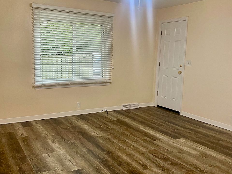 Living room with back door to the basement
