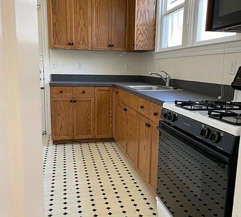 Light filled kitchen with room for a breakfast table.