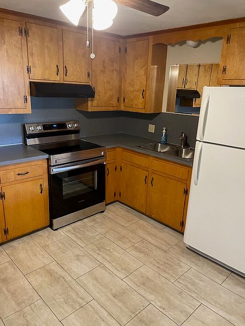 Kitchen view - refrigerator and stove